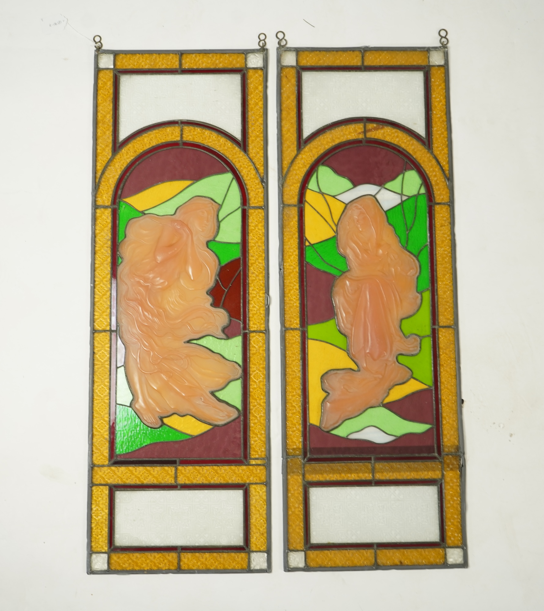 A pair of 20th century stained glass panels